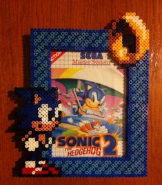 an old video game with sonic the hedgehog on it's cover and some other items