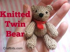 a small knitted teddy bear sitting in someone's hand with the caption knitted twin bear