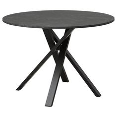 a round table with two crossed legs and a black marble top on an isolated white background