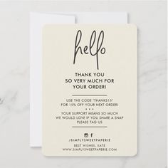 a thank card with the words hello written in cursive writing on it and an envelope