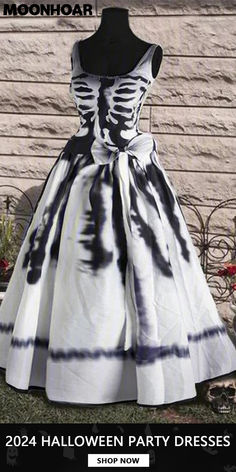 a dress that is on display in front of a wooden wall with the words halloween party dresses