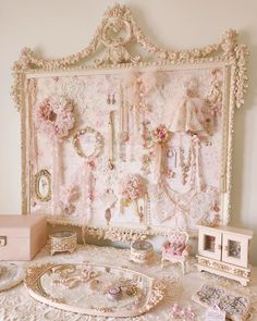 a white table topped with lots of jewelry