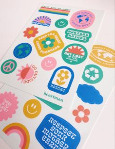 several stickers on the back of a white paper with different colors and shapes in them