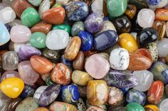 many different colored rocks are stacked together