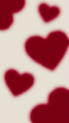 red hearts are arranged on a white background