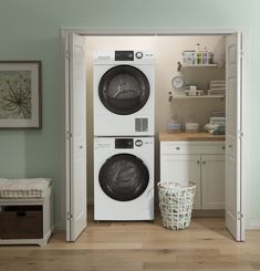 a washer and dryer sitting in a room next to each other with the door open