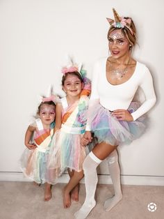 two girls and one girl are dressed up as unicorns