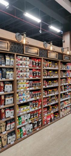 a grocery store filled with lots of food and drink bottles on shelves next to each other