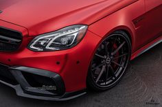 the front end of a red mercedes cla