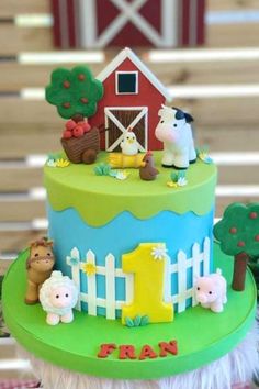 a birthday cake with farm animals on it