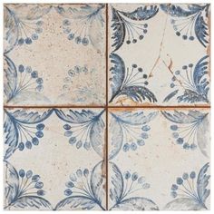 four blue and white tiles with different designs on one side, the other half circle