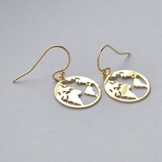 gold plated earrings with the map of the world on it