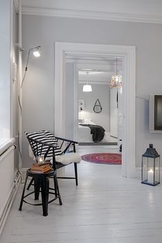 a living room filled with furniture and a flat screen tv