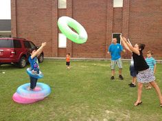 several children are playing frisbee in the grass