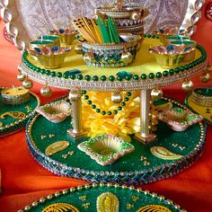 an elaborately decorated table with plates and bowls