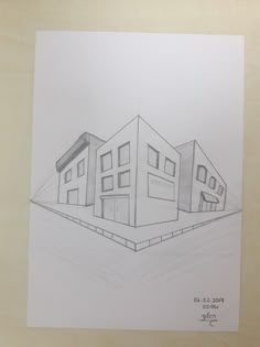 a drawing of three buildings on a paper