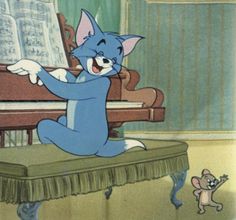 a cartoon cat sitting on top of a piano