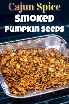 cooked pumpkin seeds on the grill with caption cajun spice smoked pumpkin seeds