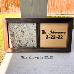 a wooden frame with the words the johnsons and 2 - 22 - 22 on it