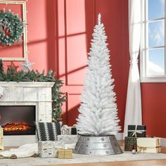 a white christmas tree in a living room