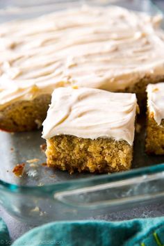 carrot cake with white frosting in a glass dish