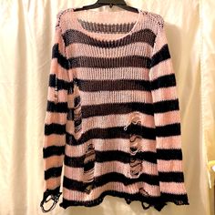 Oversized Light Pink & Black Striped Slasher Sweater Off The Shoulder Long, Loosely Knit Brand New Without Tags By Vampire Freaks Brand New And Never Worn Sheer Punk, Goth Cool! *This Is Just As It Came, The Distressed Material Doesn’t Have A Label Or Tags-But This Is Just As It Was When It Arrived, It’s Too Big That’s The Only Reason That I’m Selling It* Bundles Of 3+ Get The Best Deals! Thank You For Checking Out My Closet! You Rock!! Pet Friendly & Smoke Free Home I Upcycle Shipping Material’s Reasonable Offers Greatly Appreciated Please Come & Visit Again Soon! New Listings Posted Daily B Pastel Goth Clothing, Pink Punk Outfits, Pink And Black Goth, Pink Alternative Fashion, Vampire Freaks, Sweater Off The Shoulder, Pink Punk, Pink Goth, Pink Grunge