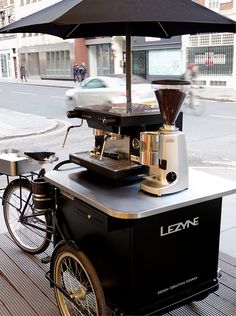 an outdoor coffee cart on the sidewalk