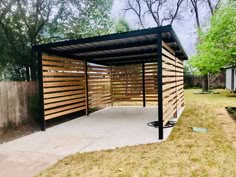 a large wooden structure in the middle of a yard