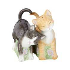 two ceramic cats sitting next to each other