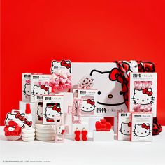 hello kitty products are displayed on a red background