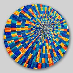 a circular painting with many different colors on it