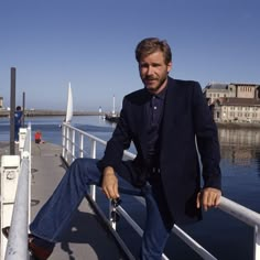 a man sitting on the edge of a boat