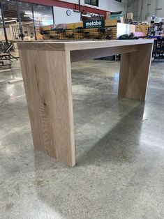 a table made out of wood in a warehouse