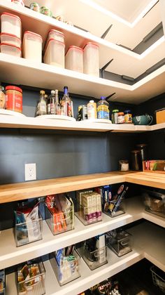 an organized pantry with lots of food and containers on the shelve shelfs