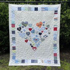 a heart quilt hanging on a clothes line