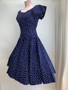 1950's Navy Blue & White Polka-Dot Drop-Waist Dress. Quality cotton fabric with a fitted bodice and a drop waist, a full gathered skirt, and a scoop neckline.  There is a metal side zipper that works great.  This garment is in EXCELLENT VINTAGE CONDITION... no issues to note. There are no stains, holes, repairs or snags. The label reads: R & K ORIGINAL personally yours **I would say that this dress is a  WOMEN'S SIZE SMALL to MEDIUM with a 27 inch waist ( I have shown this dress with a petticoat Fitted 1950s Style Polka Dot Dress, Skirt Measurement, 27 Inch Waist, Full Gathered Skirt, Vintage Hawaiian Shirts, Dropwaist Dress, Gathered Skirt, Casual Chic Style, Waist Dress