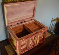 an open wooden box sitting on top of a table