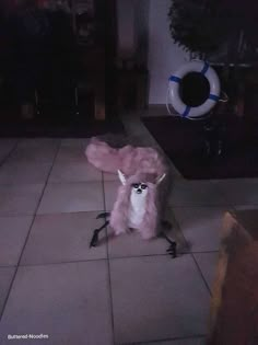 a stuffed animal is sitting on the floor