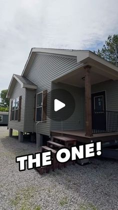 a tiny house with the words the one on it's front and side porch