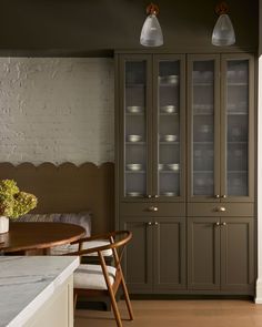 a dining room table and some chairs