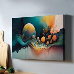 a painting hanging on the wall next to a cutting board