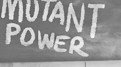 the words mutant power written in white spray paint on a black and white concrete wall