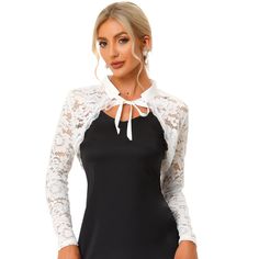 This lace cardigan is designed with a long sleeve, a unique scalloped hem with a lace trim, and a cropped shrug. The shrug top features a stand collar and an open front design that can make you wear it on and down. The elegant bolero shrug is perfect for dress-up to complete the charming look. Great for spring/fall, casual daily, cocktail, evening parties, wedding parties, work, dating, and coffee shops. Fitted Lace Shrug With Lace Trim, Long Sleeve Lace Shrug For Party, Spring Fitted Shrug With Lace Trim, Spring Party Shrug With Lace Trim, Fitted Party Shrug With Lace Trim, Fitted Shrug With Lace Sleeves For Spring, Fitted Lace Trim Shrug For Party, Fitted Lace Trim Party Shrug, Long Sleeve Lace Cardigan With Lace Patchwork