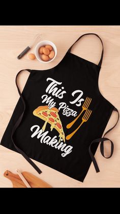 this is my pizza making apron with fork and knife next to it on a table