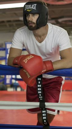 a man with a boxing glove on his knee