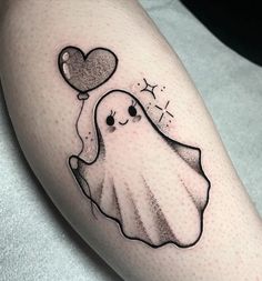 a black and white photo of a ghost with a heart on it's leg