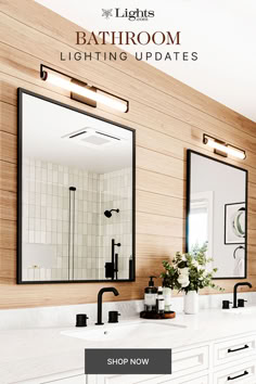 a bathroom with two sinks, mirrors and lights on the wall next to each other