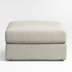 an upholstered footstool on a white background with no one in it