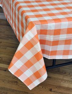 an orange and white checkered table cloth