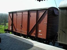 an old train car sitting on the tracks